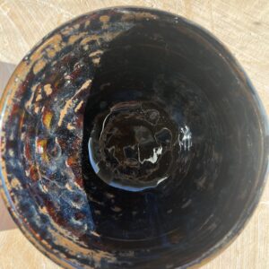 Brown bowl with blue sheen